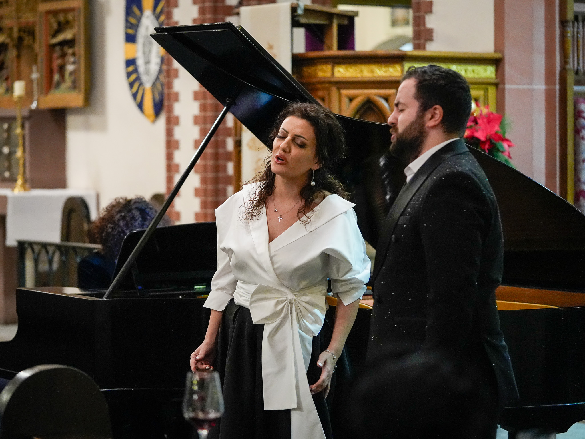 Hasmik Mkrtchyan plays in front of a Komitas portrait.